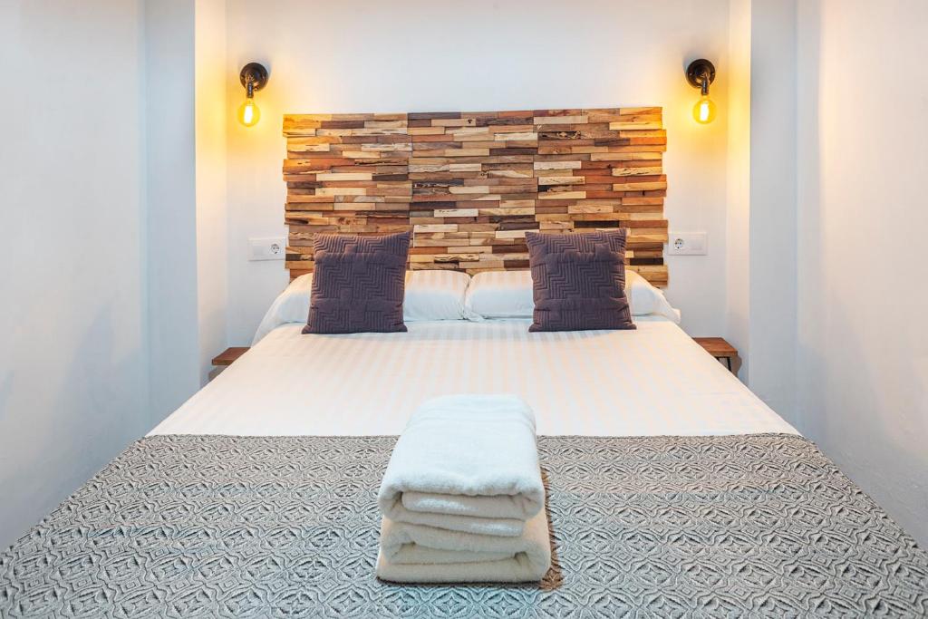 A bed or beds in a room at Alohamundi Molino