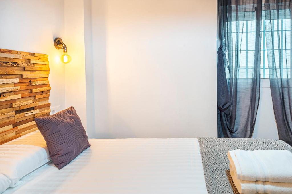 A bed or beds in a room at Alohamundi Molino