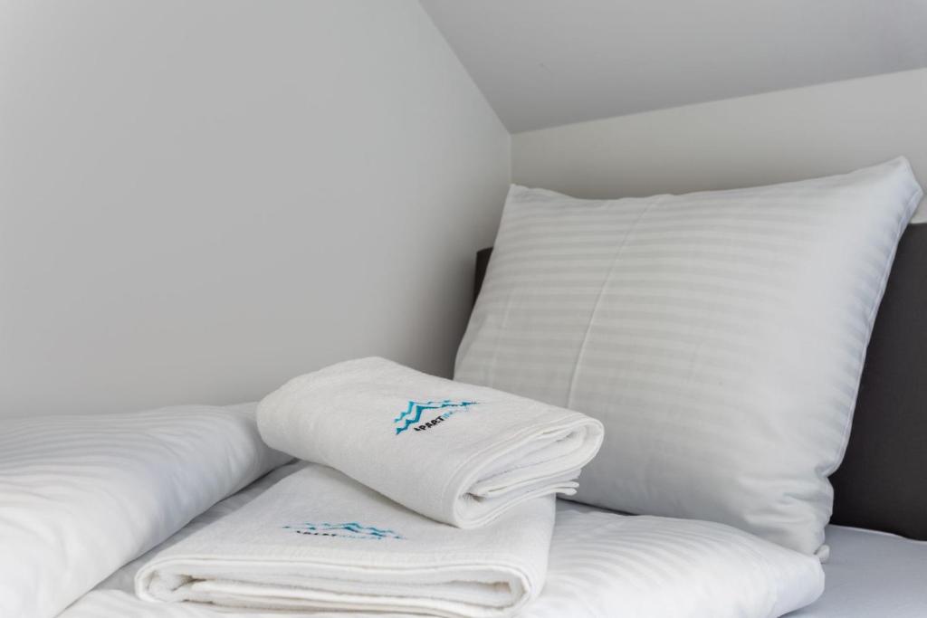 Posteľ alebo postele v izbe v ubytovaní Green Park Resort C15- z dostępem do basenu, sauny, jacuzzi, siłowni