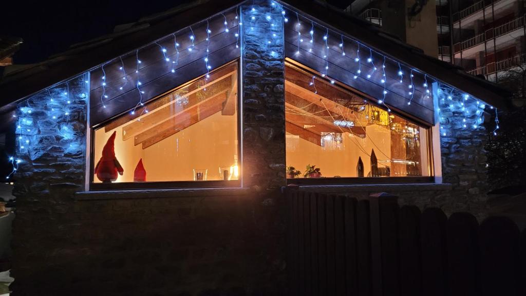 a store front with christmas lights on it at BAITA LOVELY AND CENTRAL SAUZE D'OULX in Sauze dʼOulx