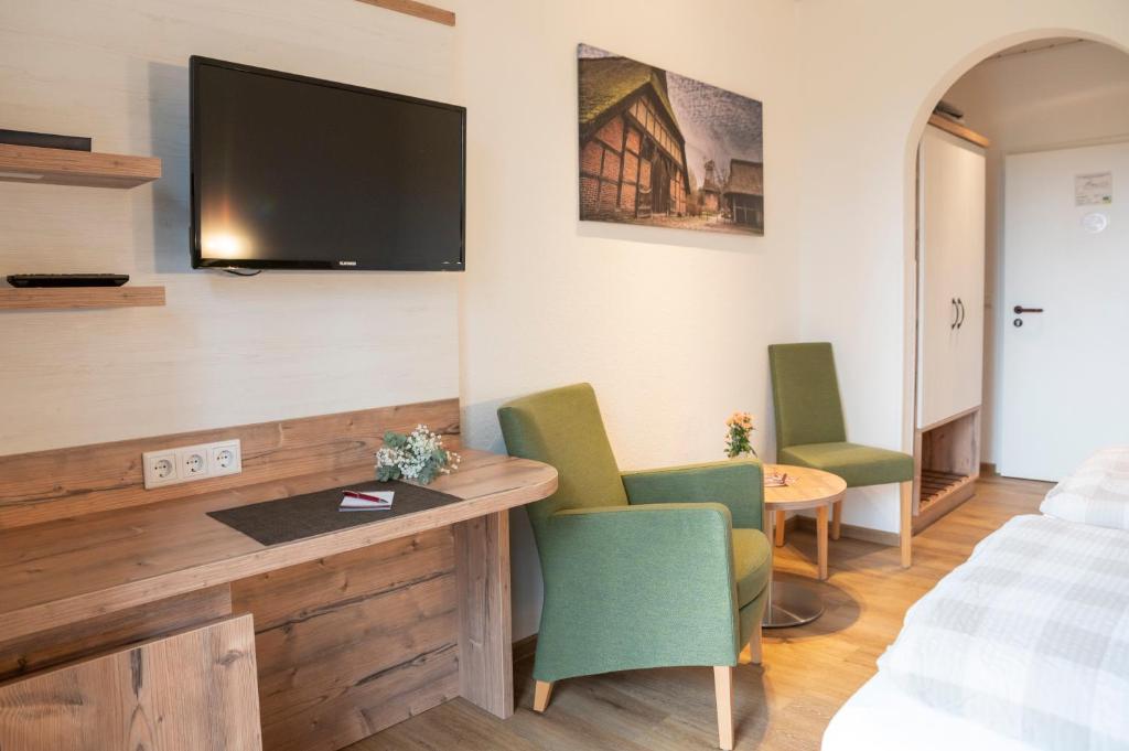 TV a/nebo společenská místnost v ubytování Hotel Am Deich