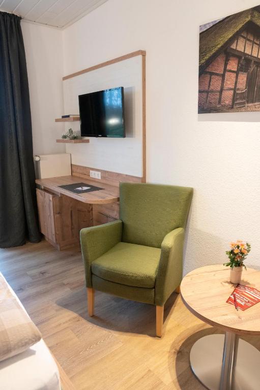 TV a/nebo společenská místnost v ubytování Hotel Am Deich