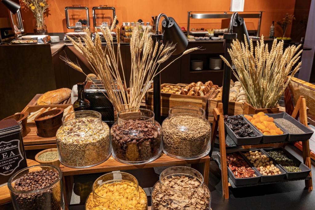 a display of different types of food in jars at Casa da Companhia, Vignette Collection by IHG in Porto