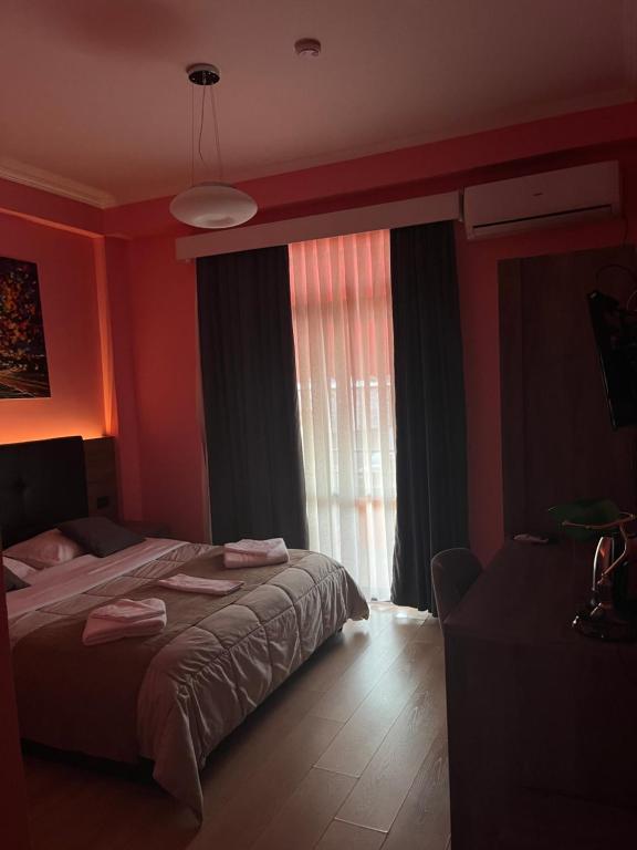Postel nebo postele na pokoji v ubytování MARION HOTEL
