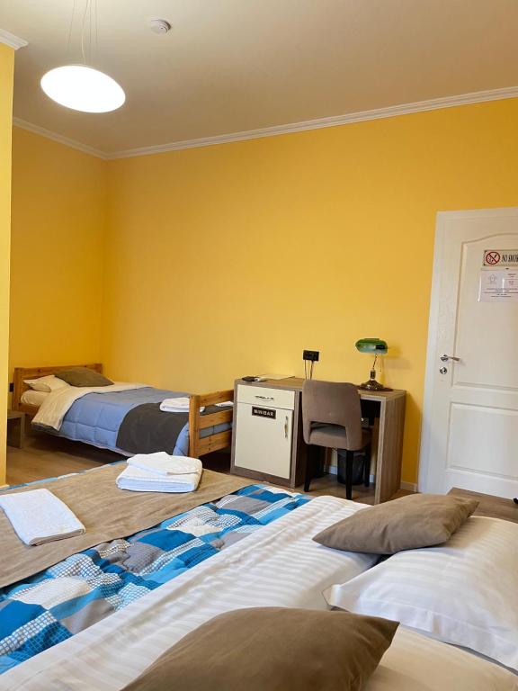 Postel nebo postele na pokoji v ubytování MARION HOTEL