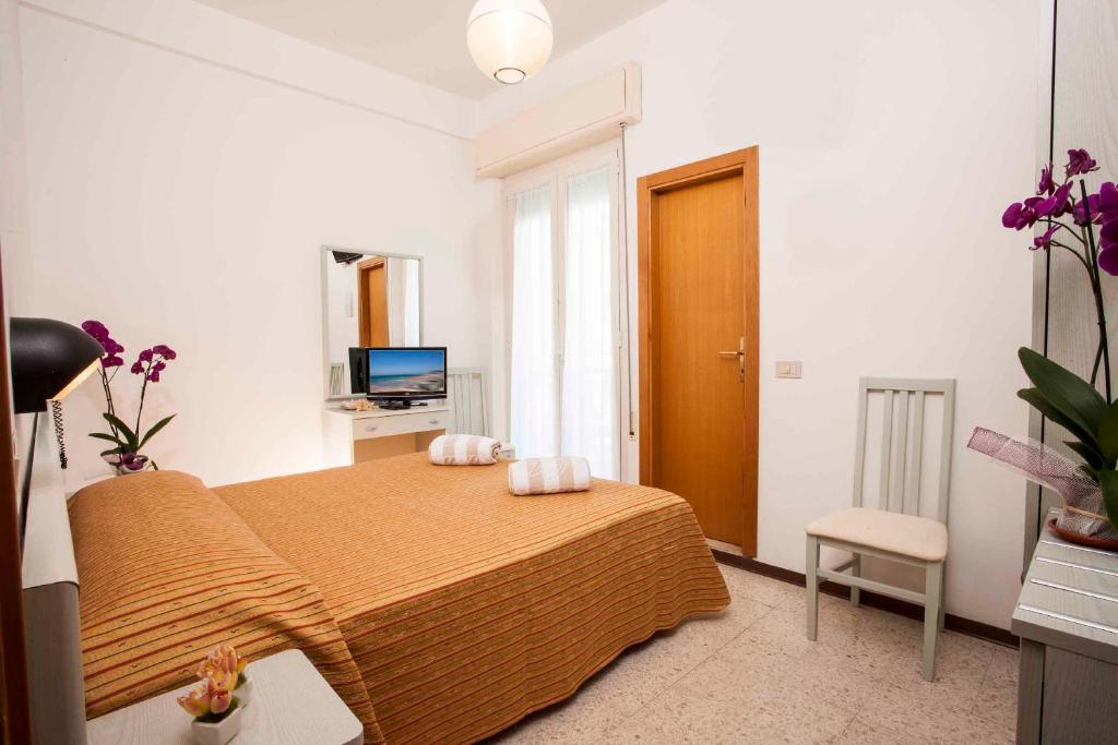 Postel nebo postele na pokoji v ubytování Hotel leonardo