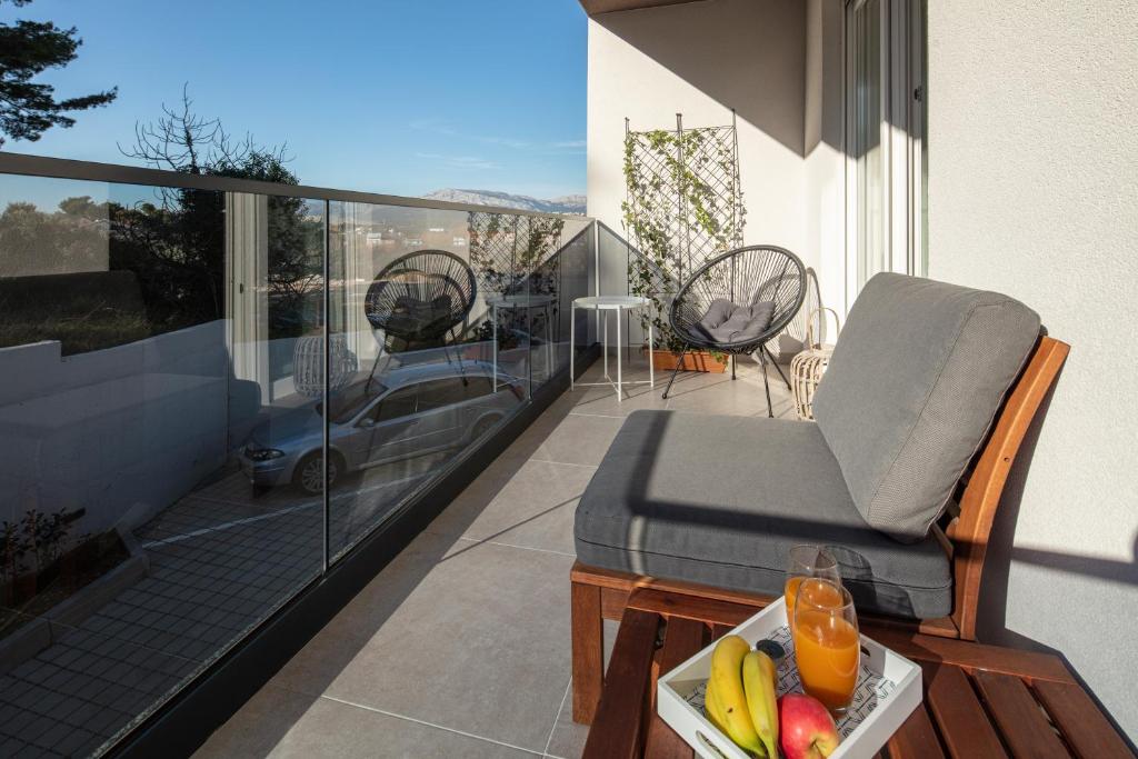 Balkón alebo terasa v ubytovaní Apartment with terrace and parking near beach