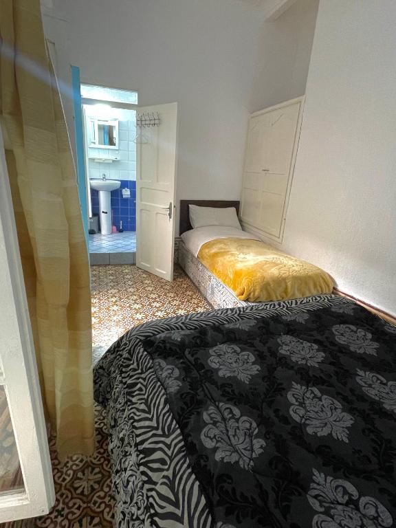 Postel nebo postele na pokoji v ubytování Riad chez brahim