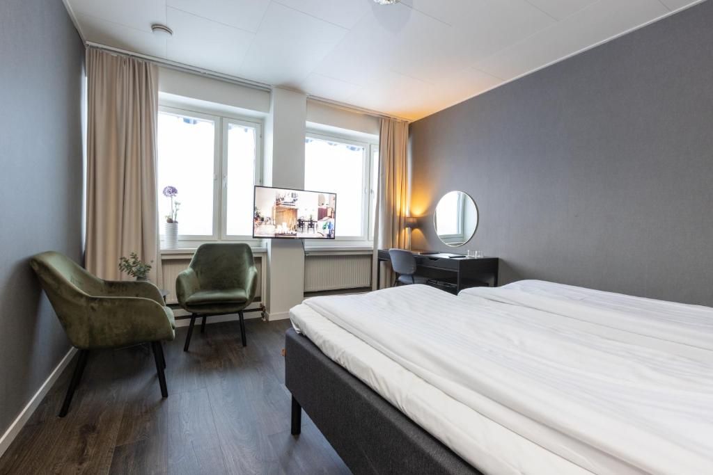 Postel nebo postele na pokoji v ubytování Hotel Victoria