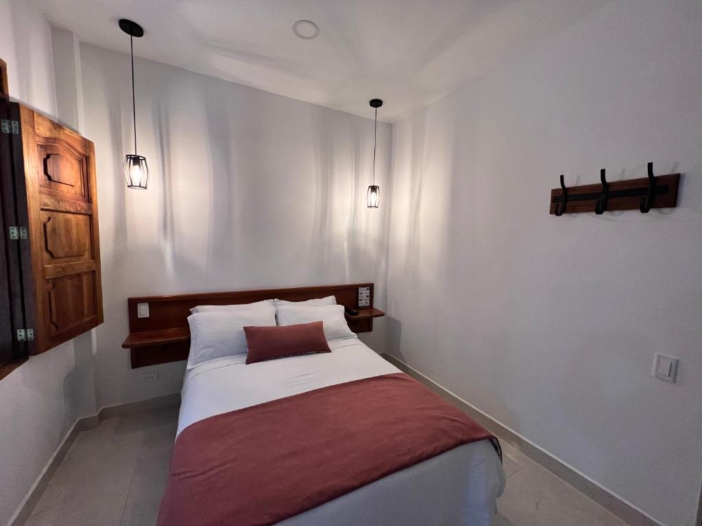 Postel nebo postele na pokoji v ubytování Casa Isabel Hotel