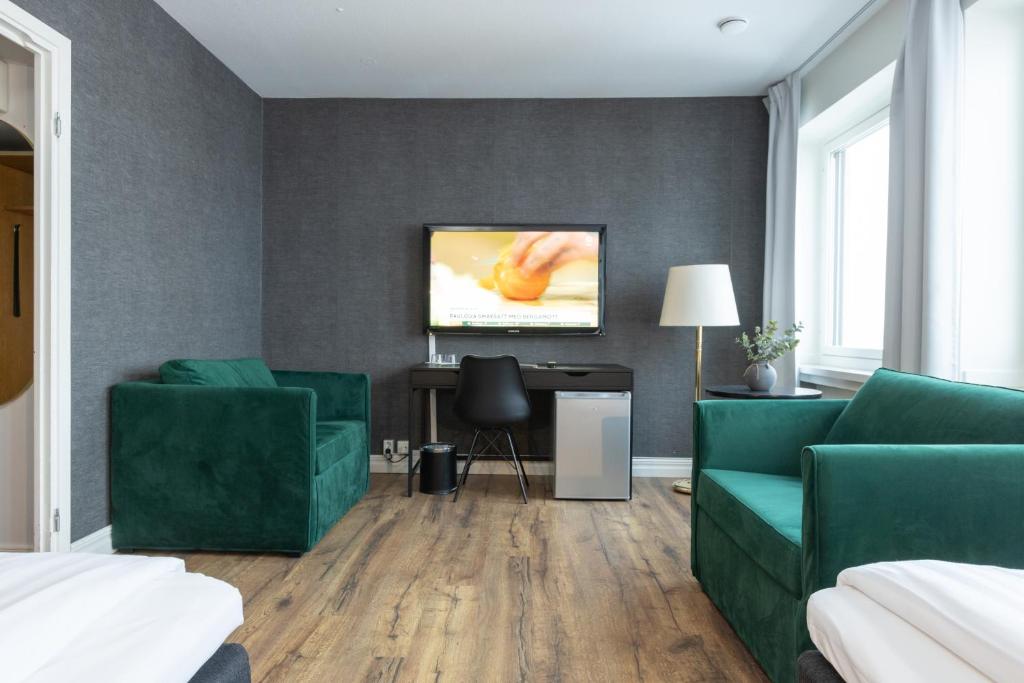 TV a/nebo společenská místnost v ubytování Hotel Victoria