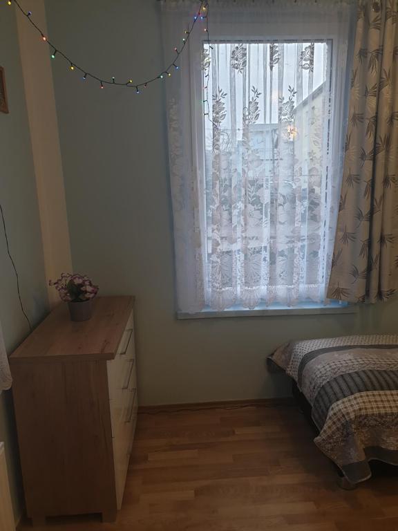 Posteľ alebo postele v izbe v ubytovaní Apartament Demiro