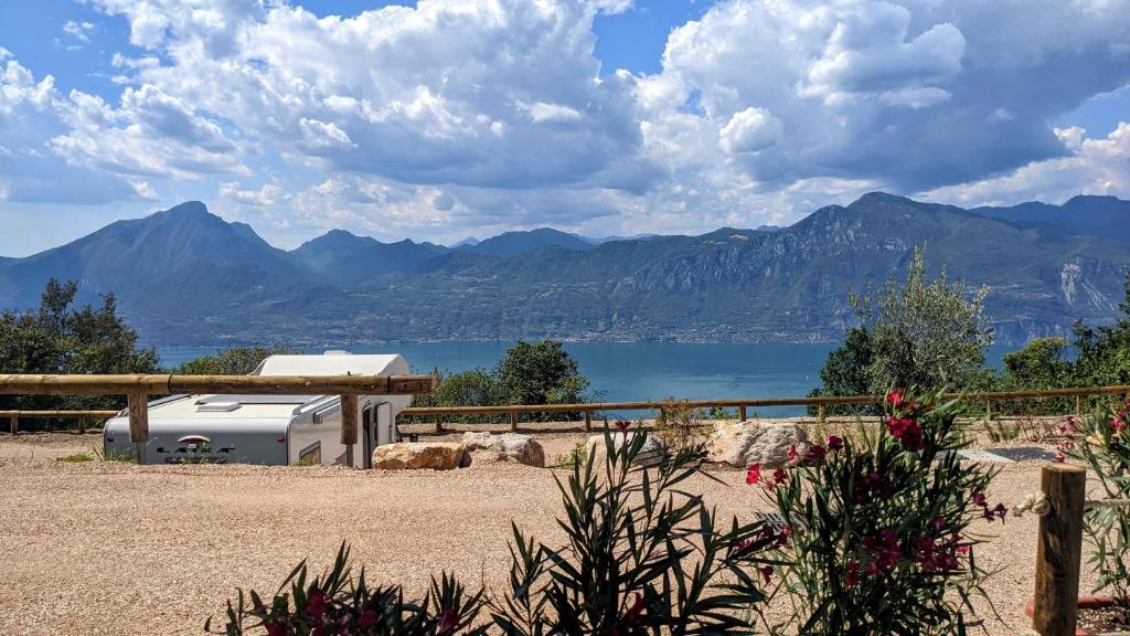 a view of a body of water and mountains at Agricampeggio La Part ONLY CAMPER in San Zeno di Montagna
