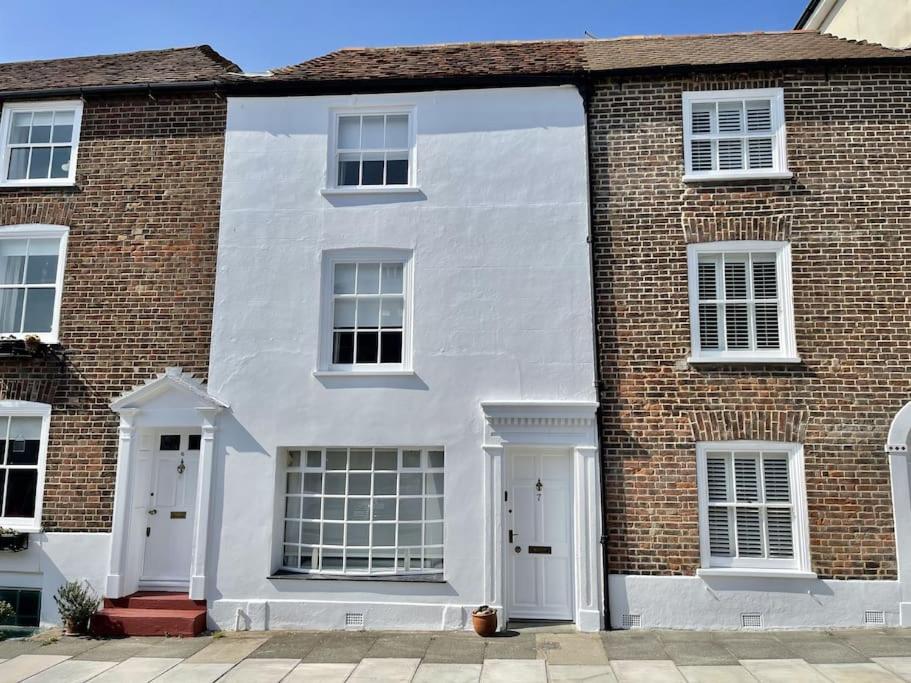 a large brick building with white doors and windows at 7 Alfred Square in Deal