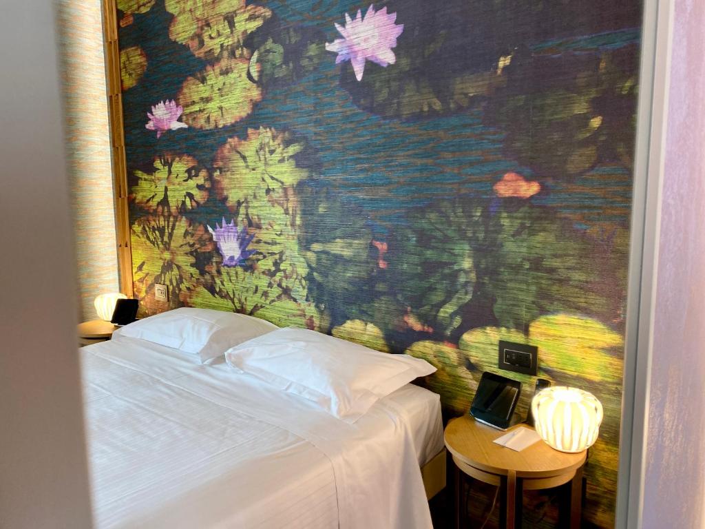 Postel nebo postele na pokoji v ubytování Hotel Firenze