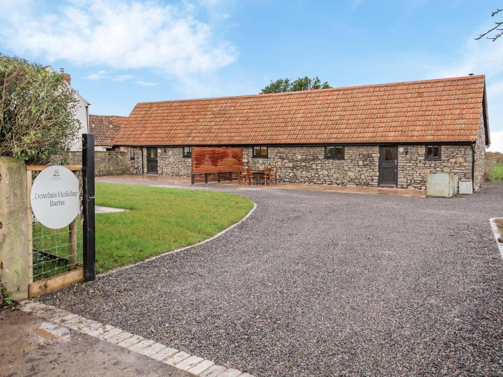 a stone building with a sign in front of it at Russet-uk41836 in Clevedon