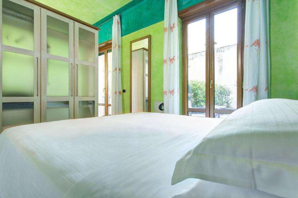 Postel nebo postele na pokoji v ubytování Hotel Firenze