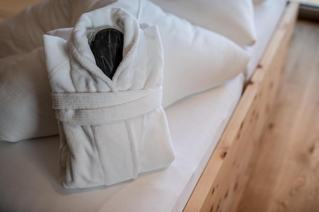 Łóżko lub łóżka w pokoju w obiekcie Naturhotel Tandler