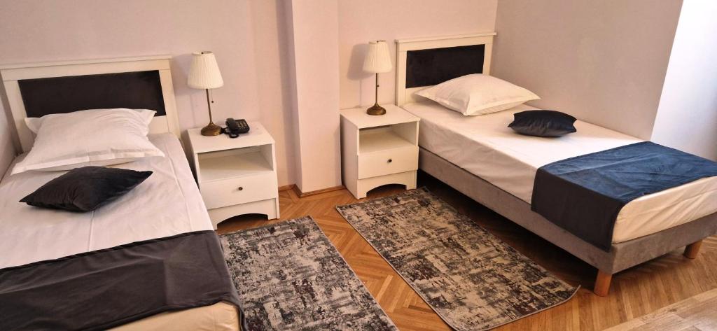 Postel nebo postele na pokoji v ubytování Hotel Triumf