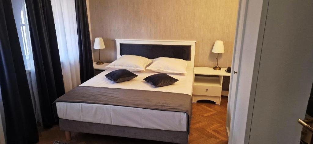 Postel nebo postele na pokoji v ubytování Hotel Triumf