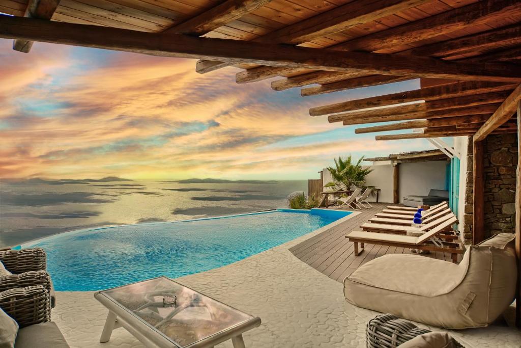 a view of the ocean from a villa with a swimming pool at Zinas Villas in Fanari