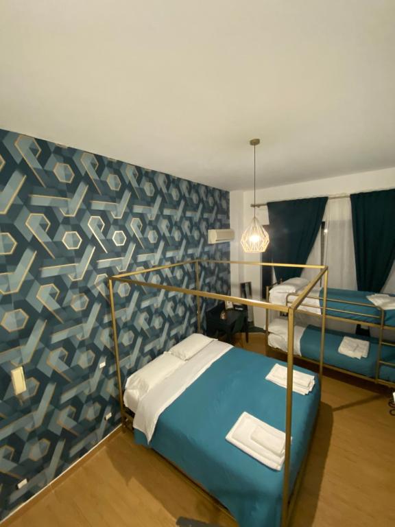 Łóżko lub łóżka w pokoju w obiekcie B&B Smeralda