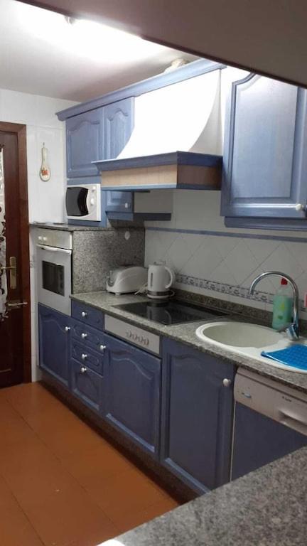 Kuchyň nebo kuchyňský kout v ubytování Marina Dor - Cala Egos- Sunny ground floor apartment with large garden
