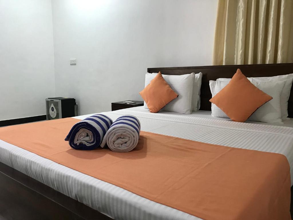 Postel nebo postele na pokoji v ubytování Paris Garden Resort