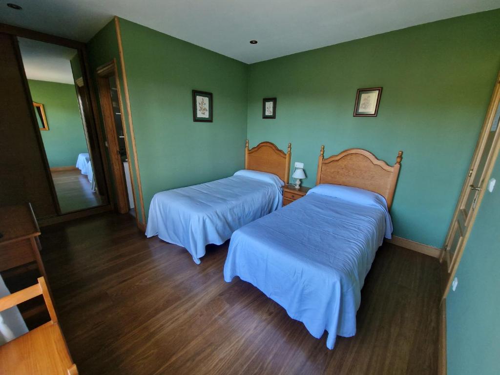 Postel nebo postele na pokoji v ubytování Hostal Lizuniaga