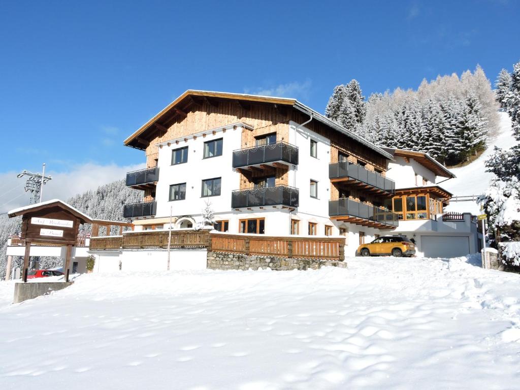 a ski lodge in the snow with snow covered ground at Gasthof Bergblick in Berwang