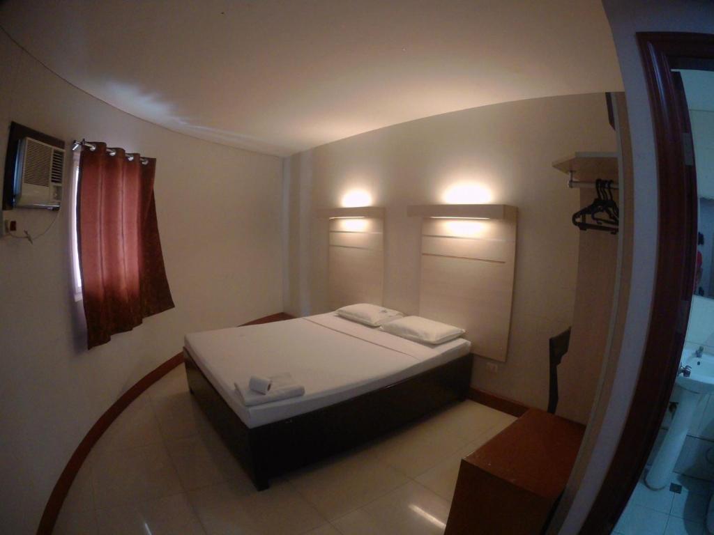 Postel nebo postele na pokoji v ubytování D' Loft Inn CDO