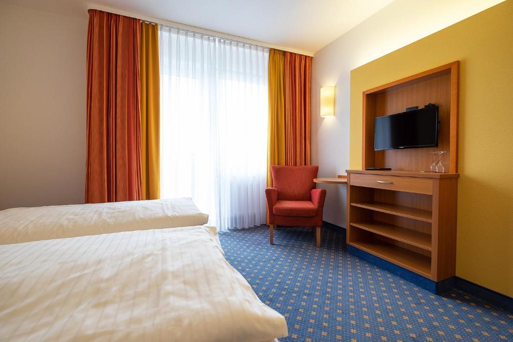 TV a/nebo společenská místnost v ubytování Hotel Am Steinberg