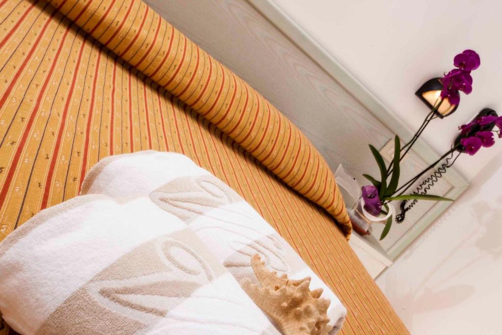 Postel nebo postele na pokoji v ubytování Hotel leonardo