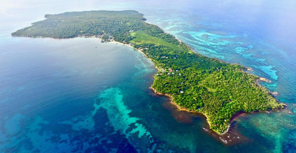 an aerial view of an island in the ocean at Lighthouse Hotel and Spa, Little Corn island, Nicaragua in Little Corn Island