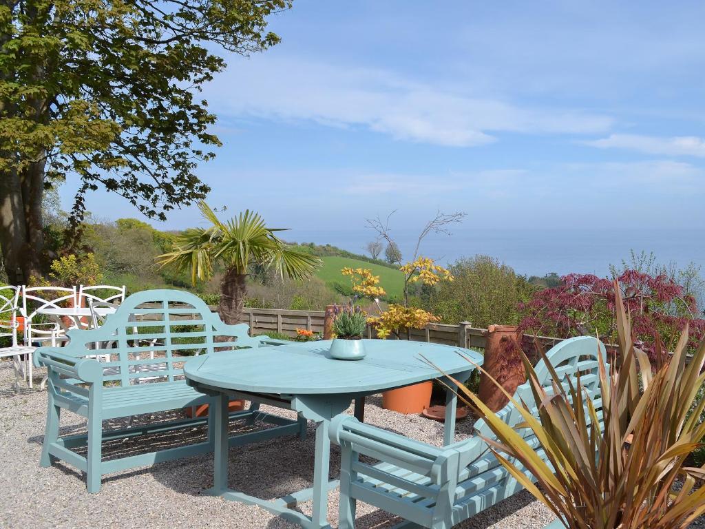 a blue table and two chairs and a table and chairs at Bluebell - 28864 in Stokeinteignhead