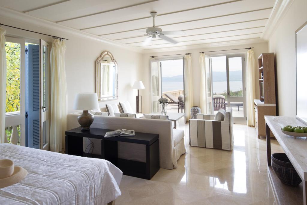 a living room with a bed and a couch at Anassa in Polis Chrysochous