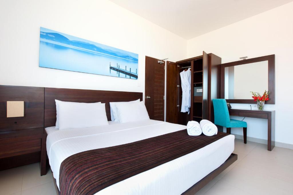 Postel nebo postele na pokoji v ubytování The Beach Apartments