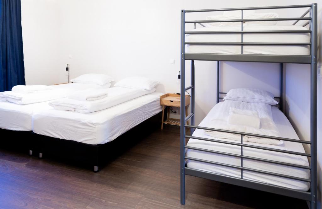 Voodi või voodid majutusasutuse Westman Islands Inn toas