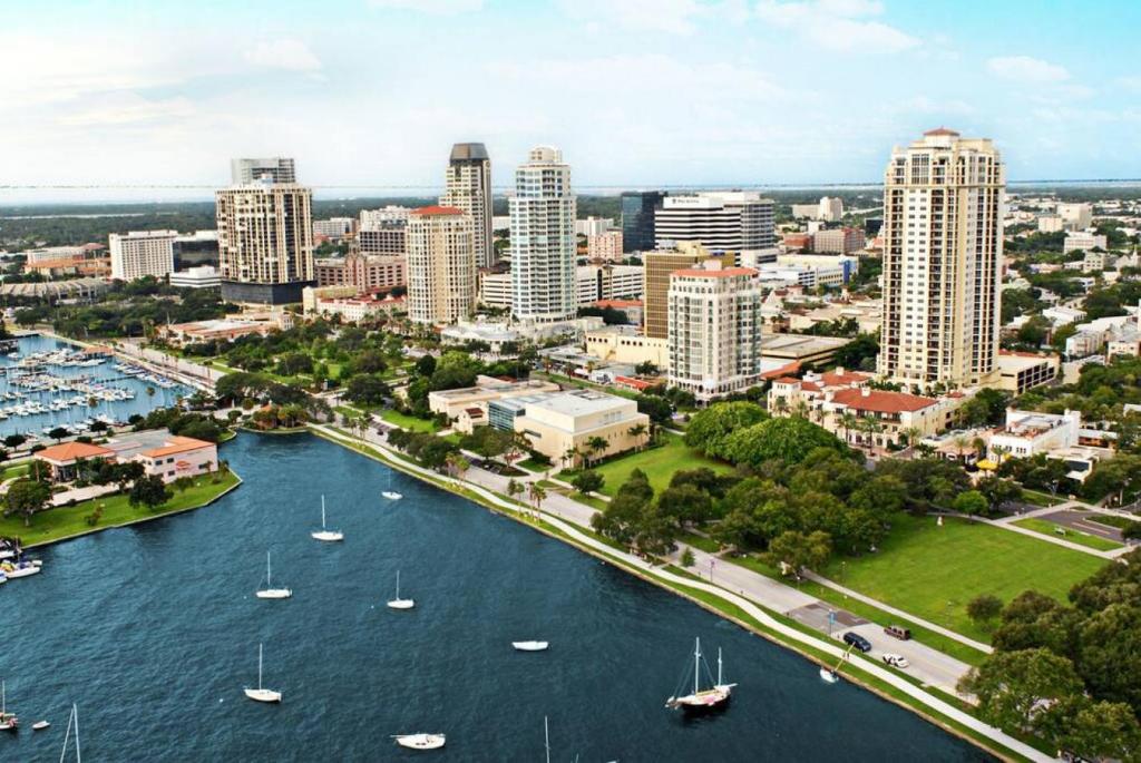 an aerial view of a city with boats in the water at Walk Everywhere Heart of Downtown St Pete in St. Petersburg