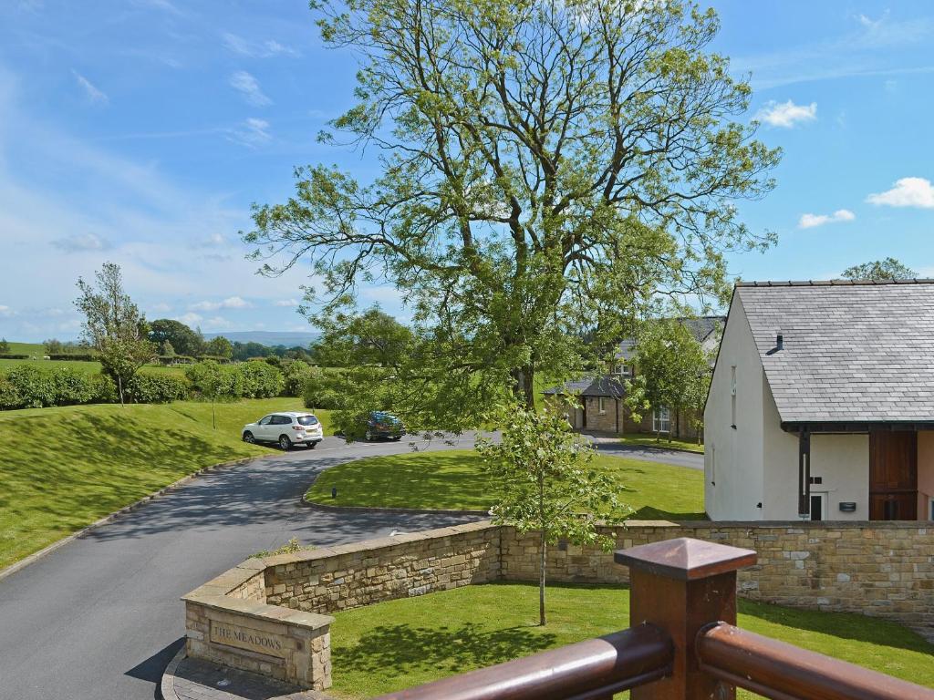 a view from the balcony of a house with a driveway at The Loft in Kirkby Lonsdale