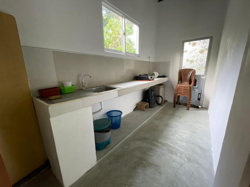 Kuchyň nebo kuchyňský kout v ubytování Blossom Inn