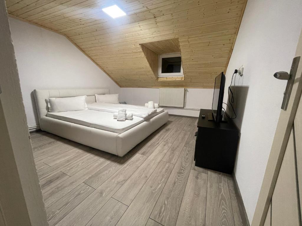 Postel nebo postele na pokoji v ubytování Vila Rustik Straja