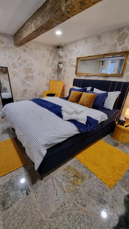 Posteľ alebo postele v izbe v ubytovaní Stone studio