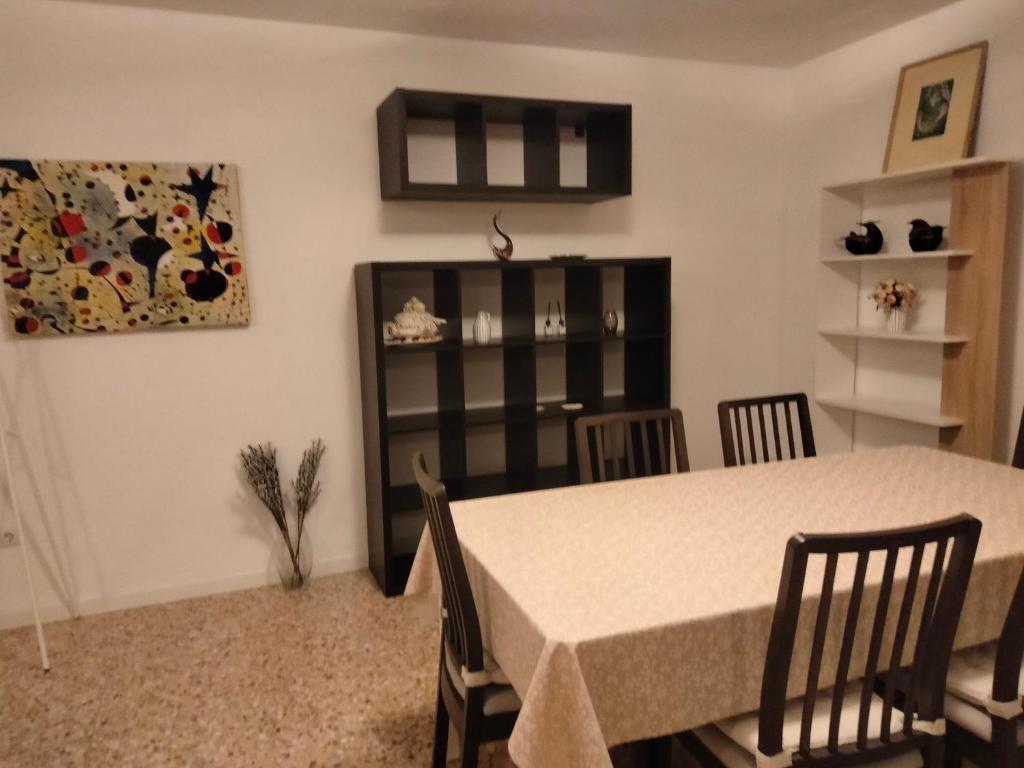 a dining room with a table and chairs at Castellon Center Modern Spacious Apartment in Castellón de la Plana