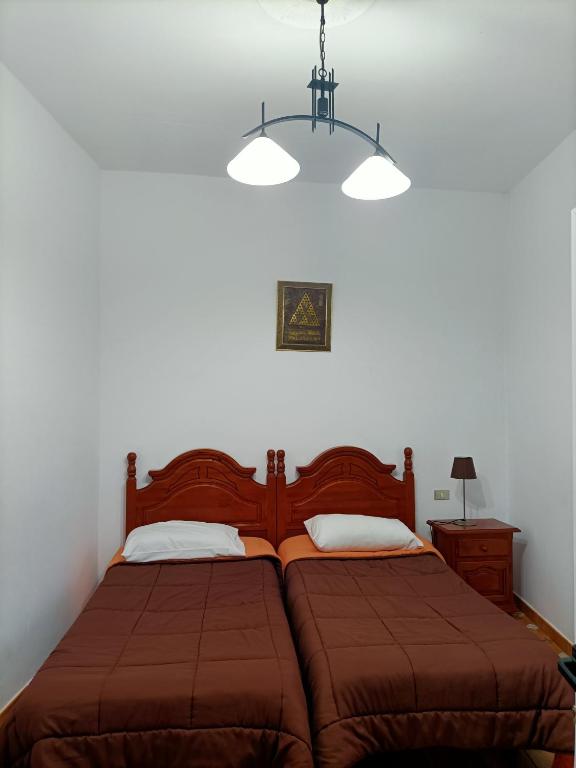 Łóżko lub łóżka w pokoju w obiekcie Vista Tunte, Camino de Santiago
