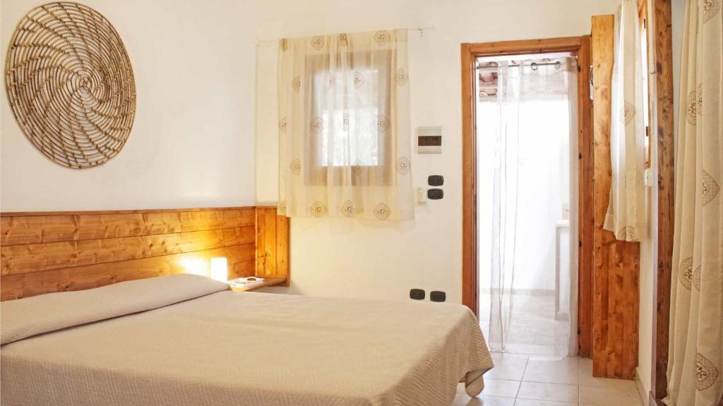 Postel nebo postele na pokoji v ubytování Villaggio Camping Sentinella