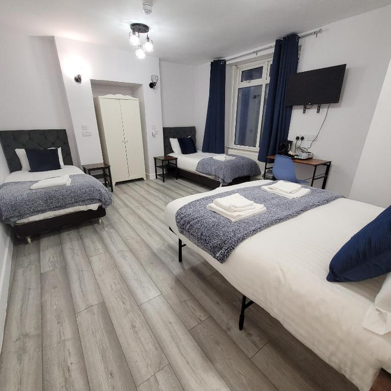 Postel nebo postele na pokoji v ubytování Argyle Square Hotel