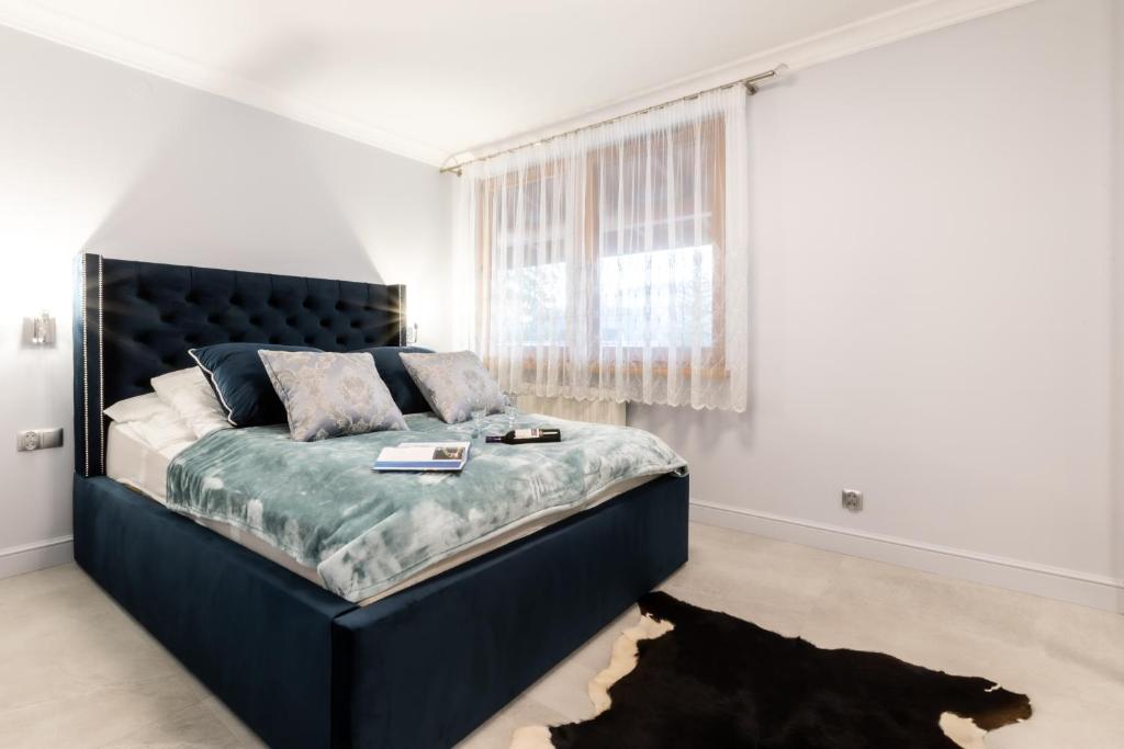 Posteľ alebo postele v izbe v ubytovaní Apartament Szafir - Viva pod Giewontem Apartamenty