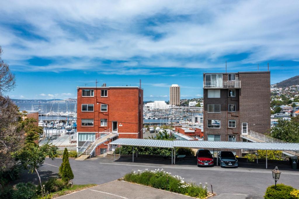 a view of a city from a parking lot at King Bed, Water Views, Private Parking, Courtyard Living in the Heart of Sandy Bay in Sandy Bay