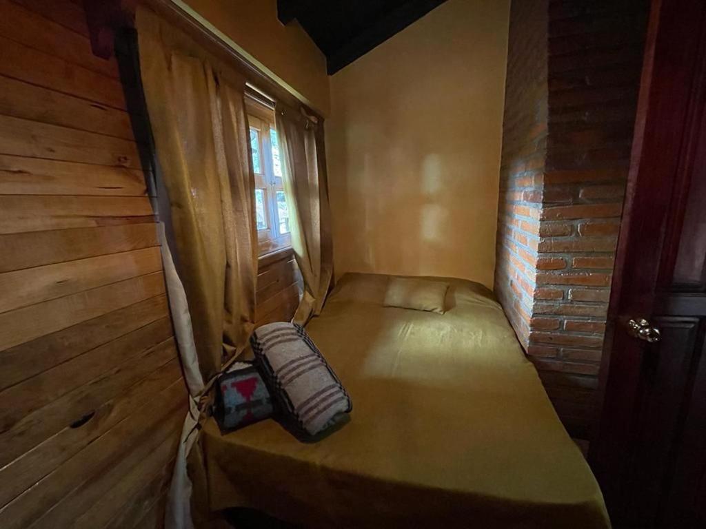 Postel nebo postele na pokoji v ubytování Villas Lupita